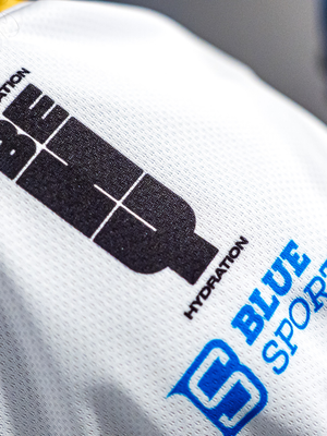 BEHY Hydration and BlueSports marks on the white jersey shoulder