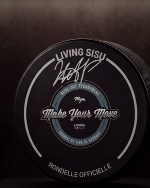Close-up of the silver autograph on the MYM 2026 puck