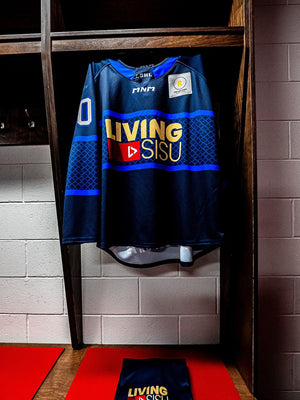 The navy LSHL jersey hanging in the dressing room stall