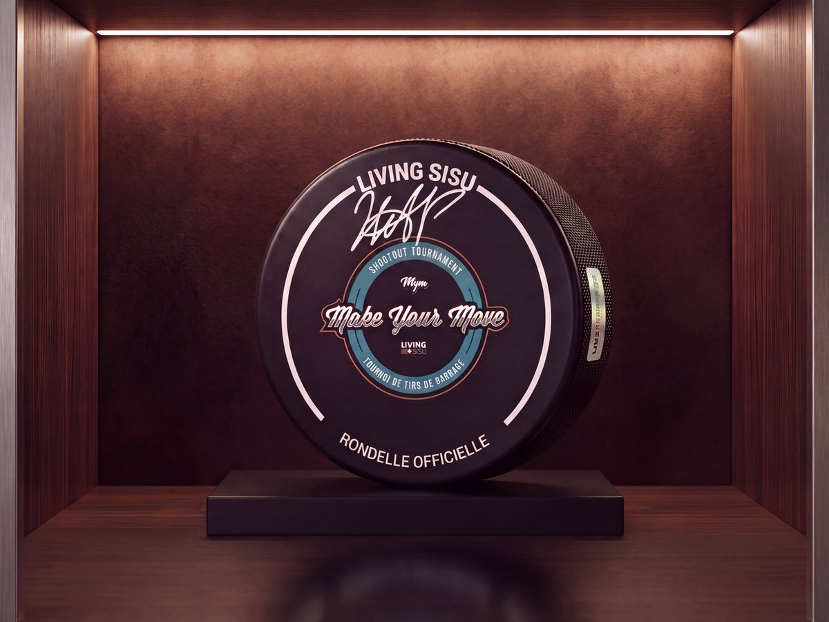 Alexander Zharovsky signed official MYM 2026 puck in a wooden display case